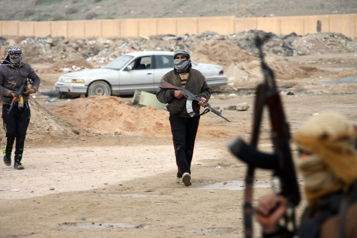Gunmen patrol after clashes with Iraqi security forces in Fallujah, 40 miles west of Baghdad, Iraq, on Sunday.