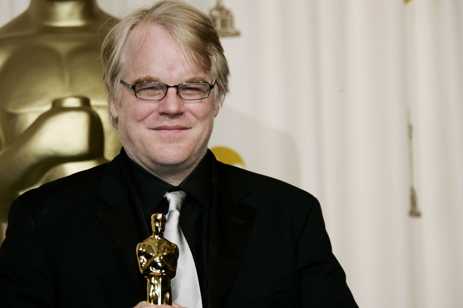 Actor Philip Seymour Hoffman poses with the Oscar he won for best actor for his work in &quot;Capote&quot; at the 78th Academy Awards, in Los Angeles. Police say Hoffman has been found dead in his apartment on Sunday.