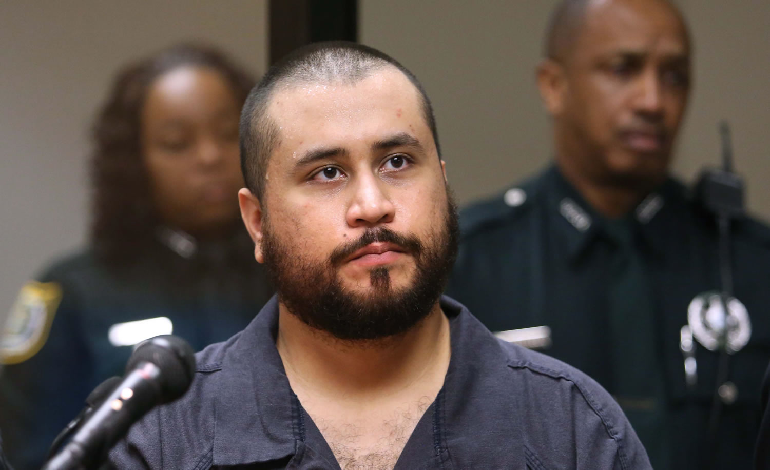 George Zimmerman, acquitted in the high-profile killing of unarmed black teenager Trayvon Martin, listens in court Nov. 19 in Sanford, Fla., during his hearing on charges including aggravated assault stemming from a fight with his girlfriend.