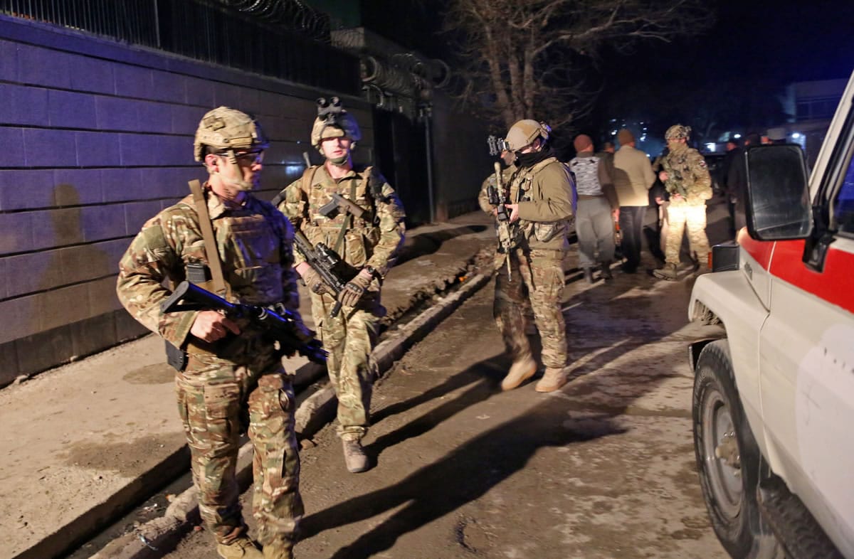 Rahmat Gul/Associated Press files
U.S. forces arrive at the site of a suicide attack Jan. 17 in Kabul, Afghanistan. The U.S. is considering leaving some troops in Afghanistan after the official withdrawal.