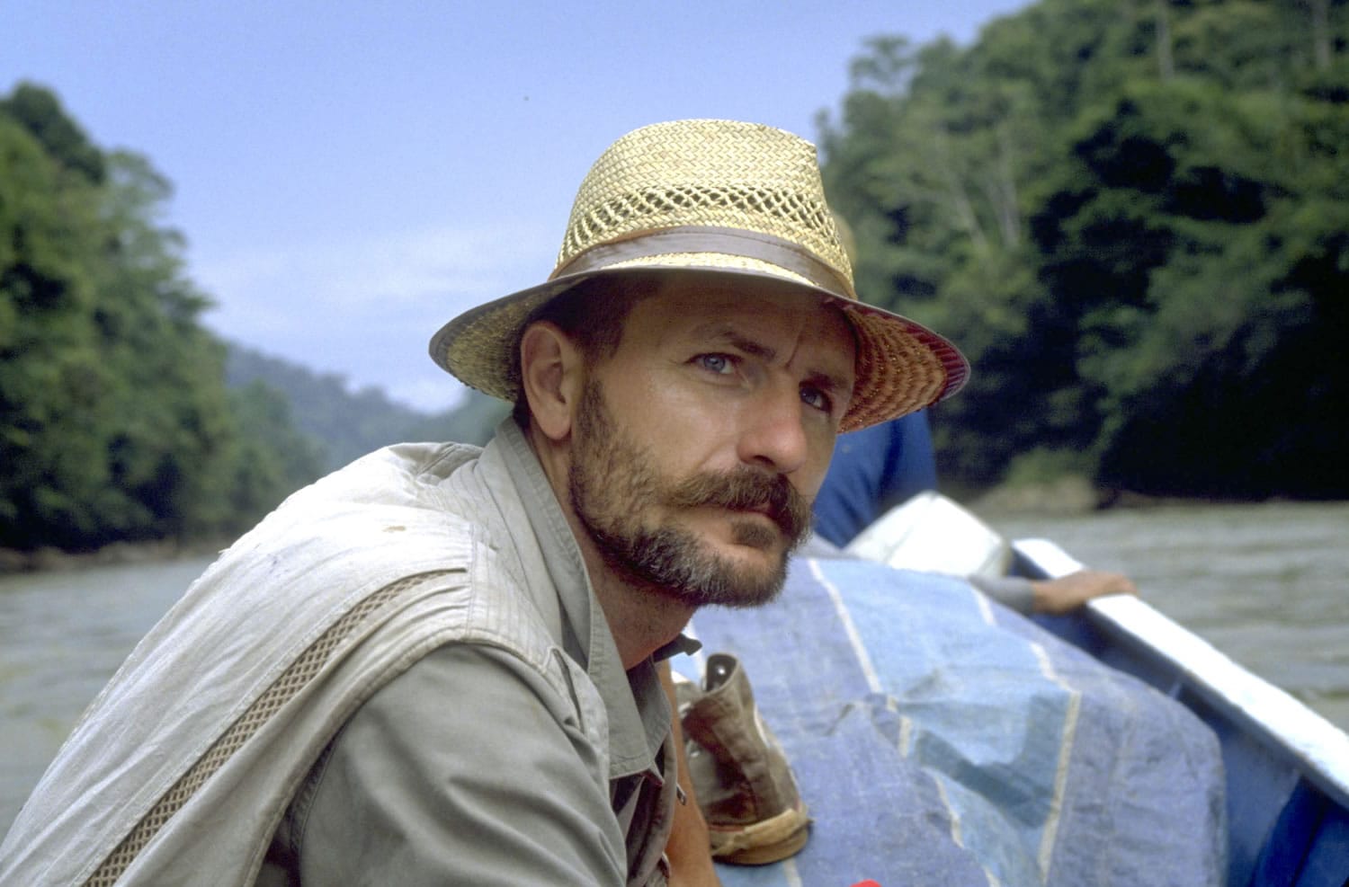 Pelton travels by boat along the Sembakung river on the island of Borneo, Indonesia, in 1996.