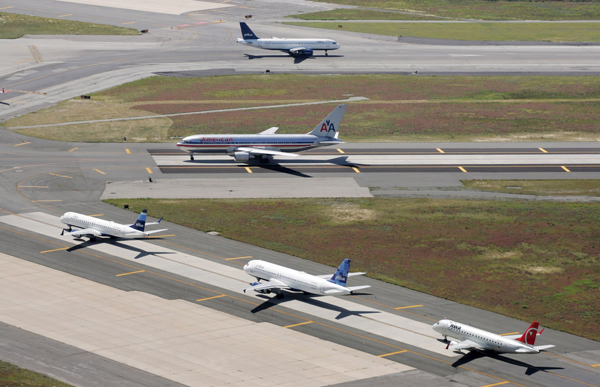 Taxiing planes line up on runways at John F. Kennedy International Airport in New York.