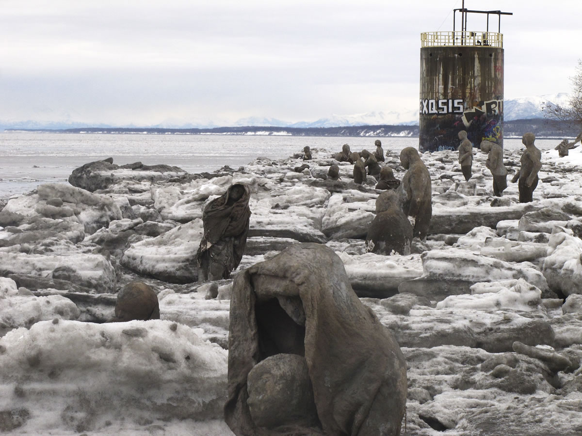 Sculptures made of straw, cement, plaster and burlap are part of a public art installation Tuesday at Point Woronzof in Anchorage, Alaska.