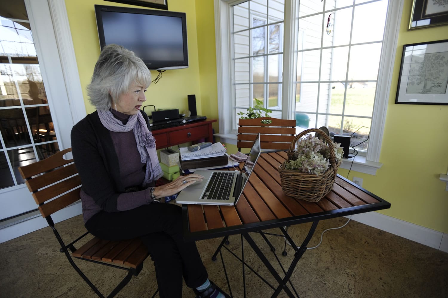 Terri Roberts, mother of Charles Carl Roberts IV, the gunman in the Nickel Mines Amish schoolhouse massacre, works on her computer at her home in Strasburg, Pa.