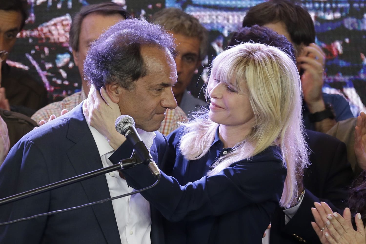 Daniel Scioli, the ruling party presidential candidate, is hugged by his wife Karina Rabolini after he delivered his concession speach to opposition candidate Mauricio Macri during Argentina&#039;s presidential election in Buenos Aires,  Sunday, Nov. 22, 2015. Macri has won Argentina&#039;s historic runoff election, putting an end to the era of President Cristina Fernandez, who along with her late husband dominated the political scene and rewrote the country&#039;s social contract. (AP Photo/Victor R.