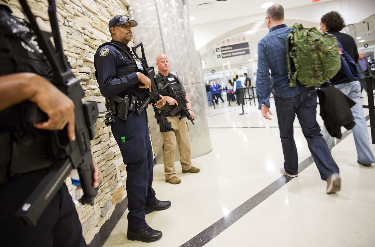 Police officers stand guard by a security checkpoint at HartsfieldJackson Atlanta International Airport, Wednesday, Nov. 18, 2015, in Atlanta.