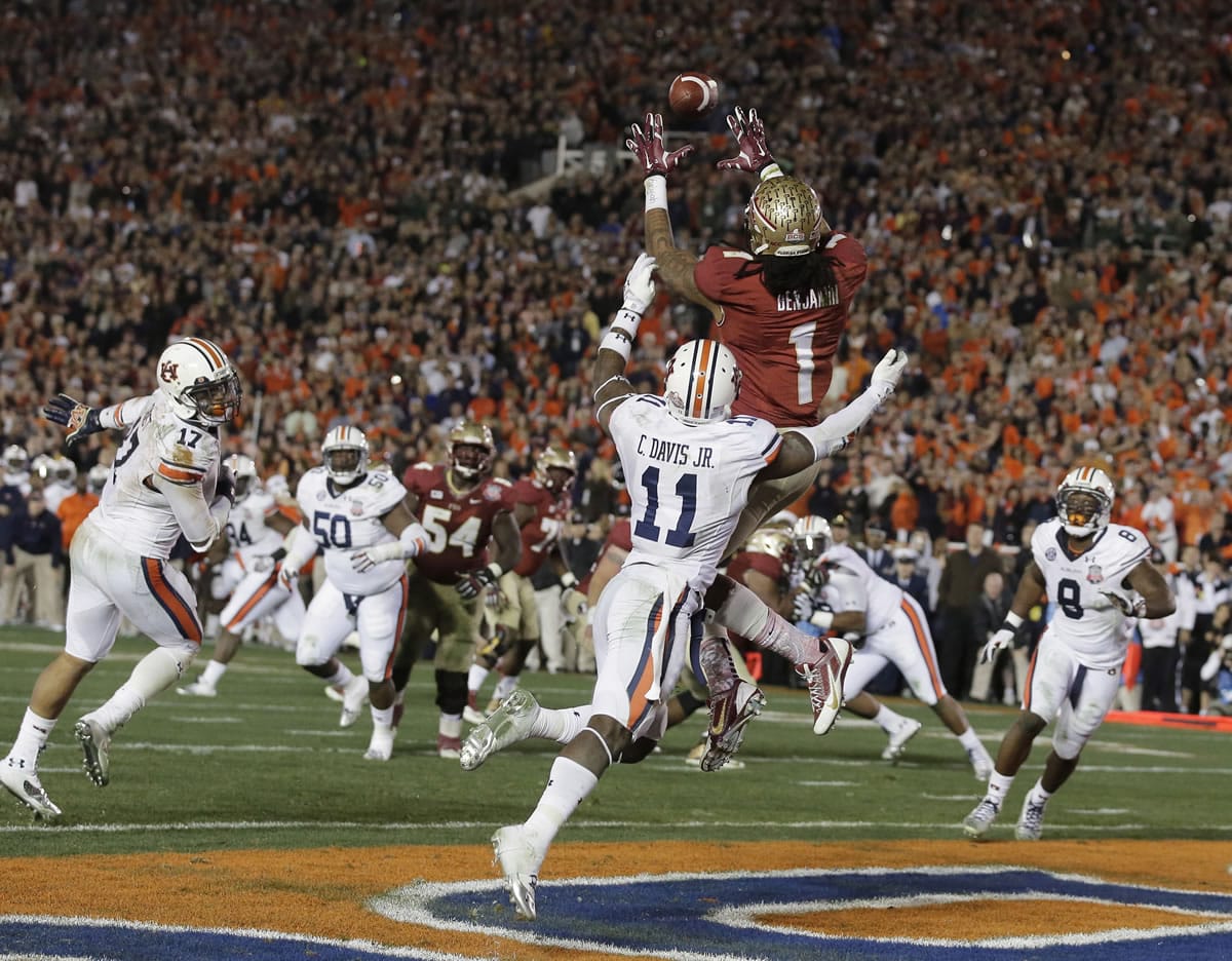 Florida State's Kelvin Benjamin catches the game-winning touchdown pass during the closing seconds of the fourth quarter of the BCS National Championship game against Auburn on Monday.