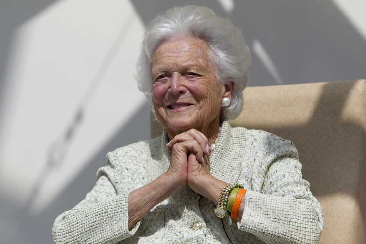 Former first lady Barbara Bush listens to a patient's question during a visit to the Barbara Bush Children's Hospital at Maine Medical Center in Portland, Maine, in July.