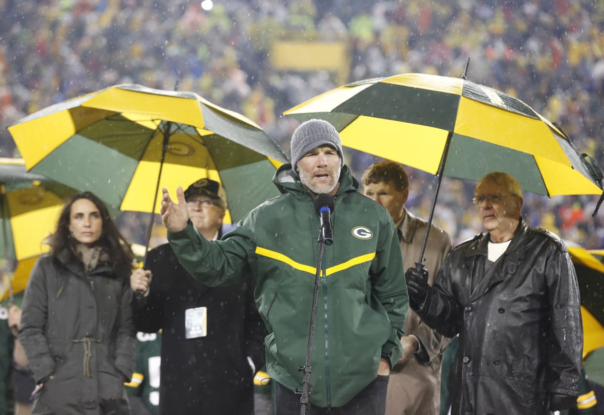 Brett Favre speaks during a ceremony at halftime of an NFL football game between the Green Bay Packers and Chicago Bears Thursday, Nov. 26, 2015, in Green Bay, Wis. Favres retired No. 4 and name were unveiled inside Lambeau Field during the ceremony.