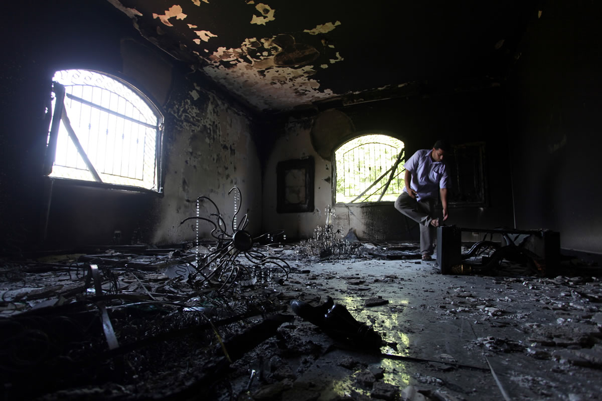 A Libyan man investigates the inside of the  U.S. Consulate in Benghazi, Libya, after an attack that killed four Americans, including Ambassador Chris Stevens, on Sept 13, 2012.