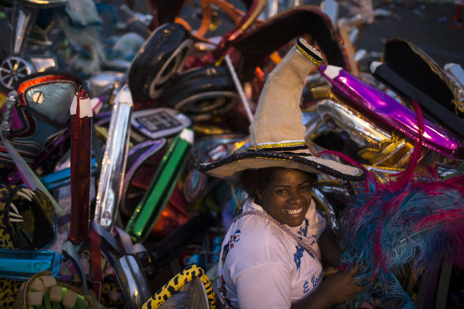 Elaine da Silva Moraes stands amid discarded costumes after carnival celebrations at the Sambadrome on Tuesday in Rio de Janeiro, Brazil.