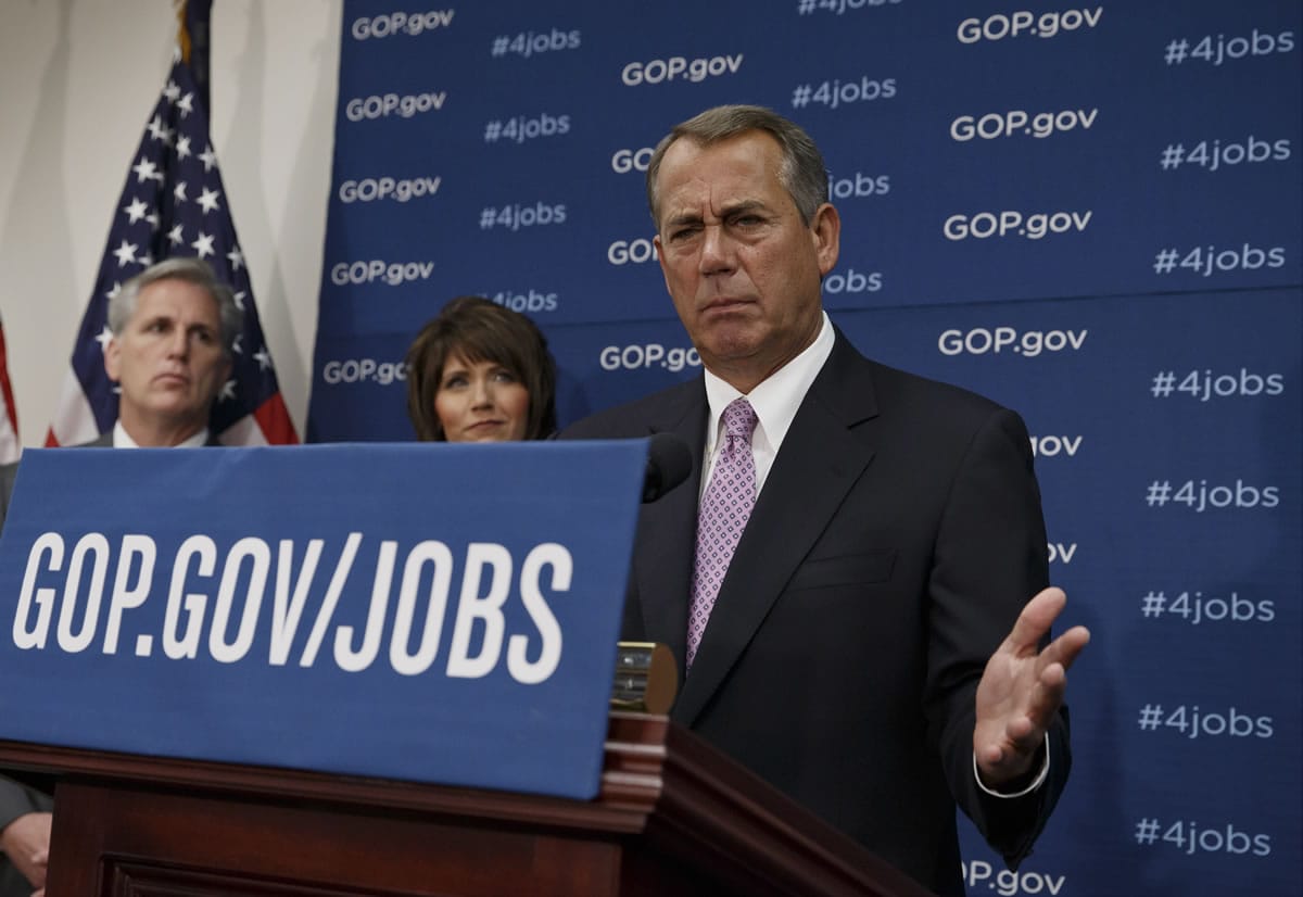 House Speaker John Boehner of Ohio, and GOP leaders face reporters on Capitol Hill in Washington on Tuesday, following a weekly House Republican Conference meeting. Behind Boehner are, from left, House Majority Whip Kevin McCarthy of Calif., and Rep. Kristi Noem, R-S.D.