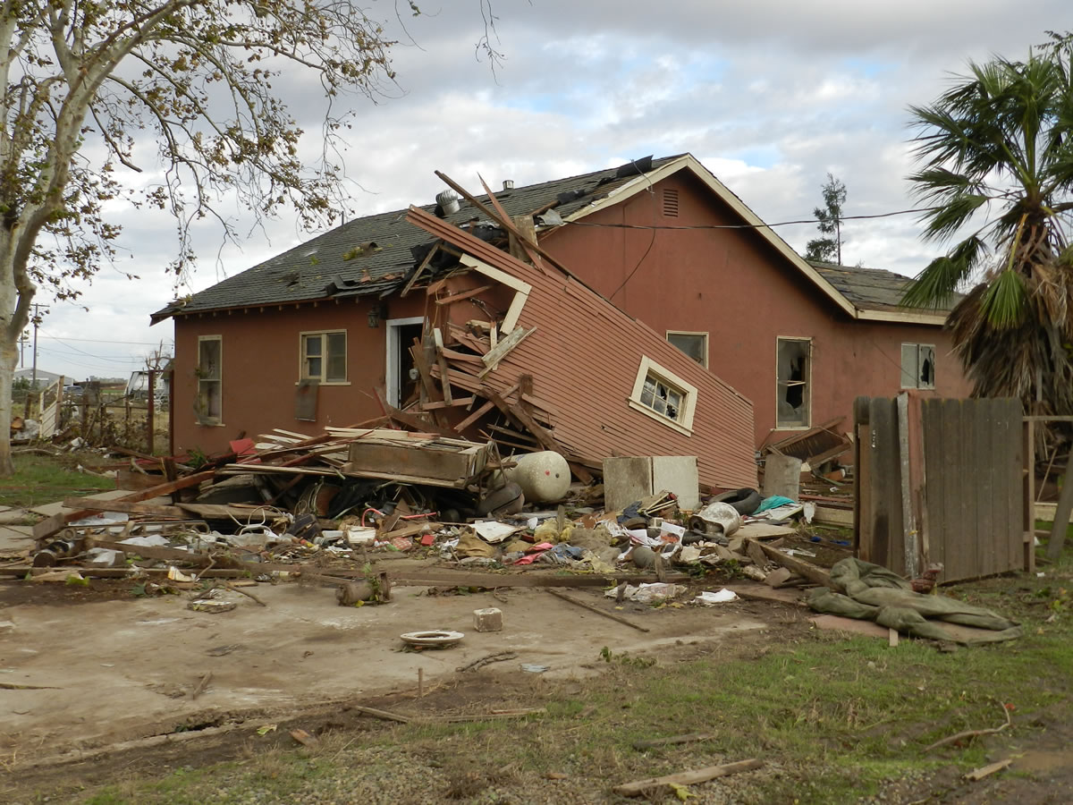Debris lies on the ground where Sabina and Zane Woodard's garage once stood after reports of a rare tornado in Denair, Calif., Sunday, Nov. 15, 2015. The National Weather Service said video and witness reports confirm a tornado touched down in Denair, which tore roofing and walls, knocked down trees and power lines and damaged gas lines.