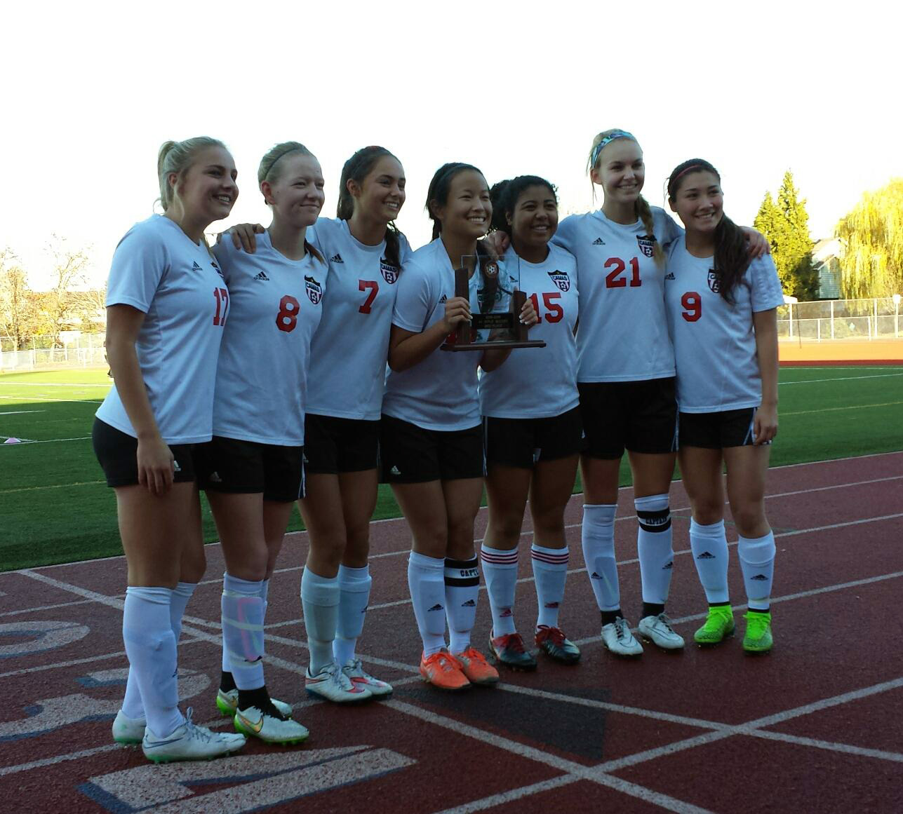 The seniors of the Camas girls soccer team with the WIAA third place state trophy on Saturday, Nov. 21, 2015.