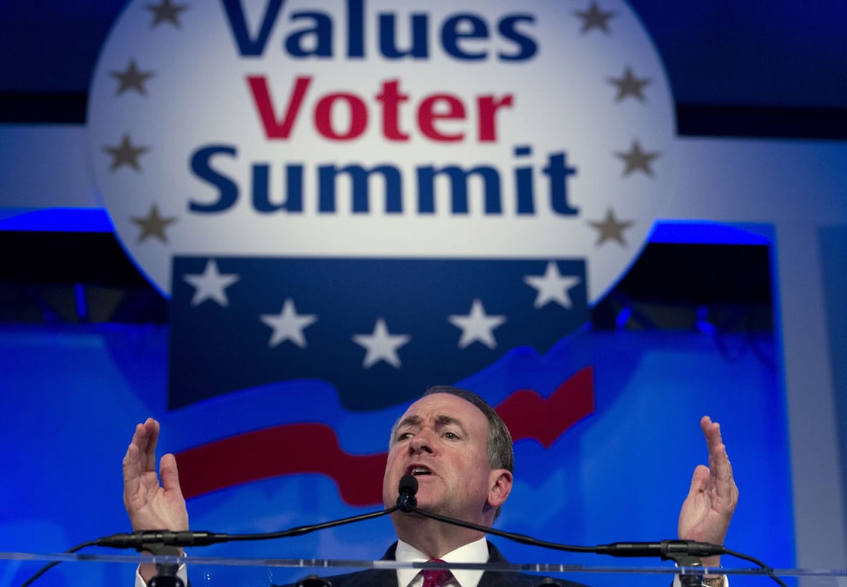 Republican presidential candidate and former Arkansas Gov. Mike Huckabee speaks in September during the Values Voter Summit, held by the Family Research Council Action, in Washington. Some leading Republican presidential candidates seem to view Muslims as fair game for increasingly harsh words they might not dare use against any other group for fear of the political cost. So far, that strategy is winning support from conservatives influential in picking the nominee.