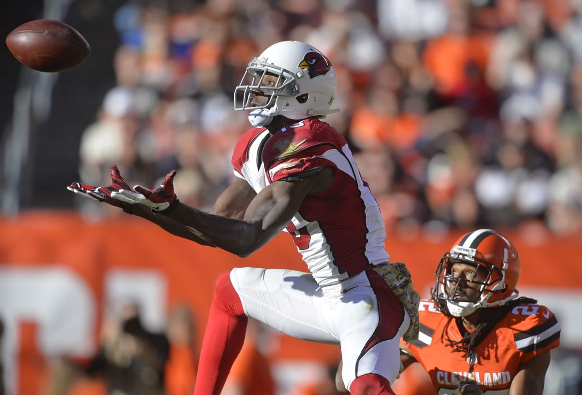 Arizona Cardinals wide receiver Jaron Brown (13) brings in a catch for a first down during a Nov. 1 game at Cleveland.
