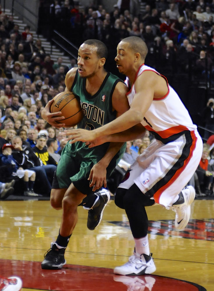 Boston Celtics' Avery Bradley, left, drives against Portland Trail Blazers' CJ McCollum during the first half Saturday.
