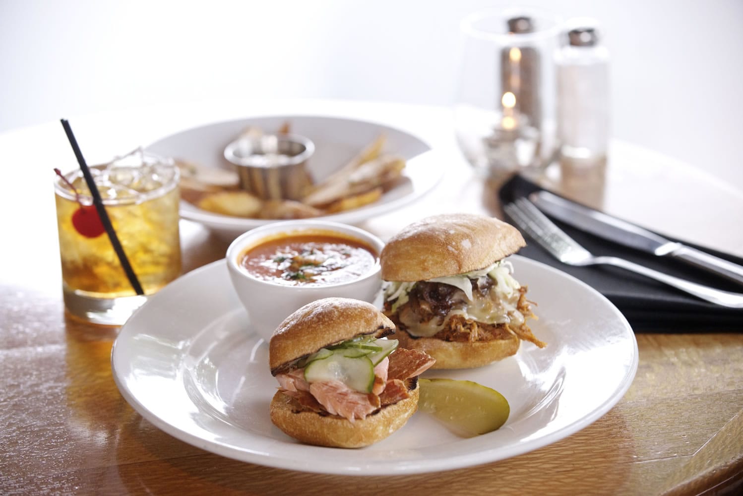Charlie's Bistro in Vancouver serves a BBQ Pork Slider and a Smoked Salmon &amp; Cucumber Slider with Sweet Potato Fries.