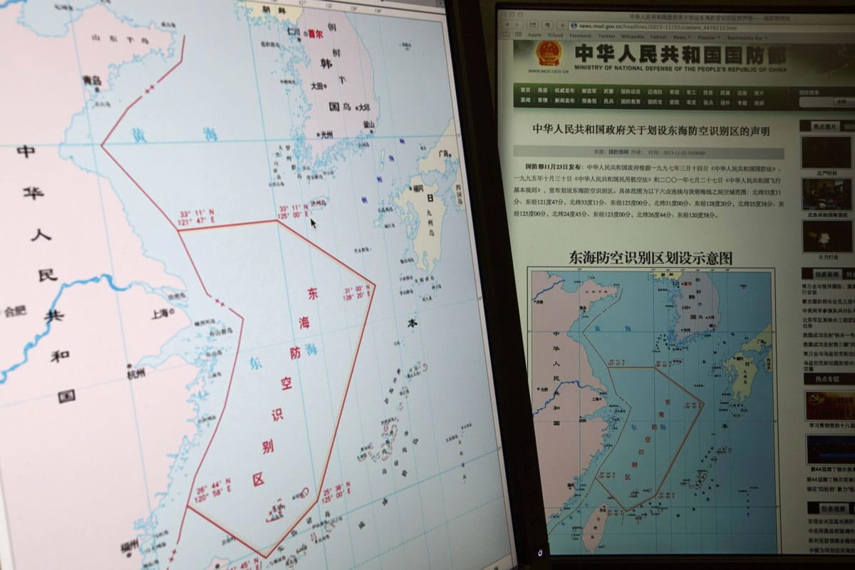 Computer screens display a map showing the outline of China's new air defense zone in the East China on the website of the Chinese Ministry of Defense, in Beijing on Tuesday.
