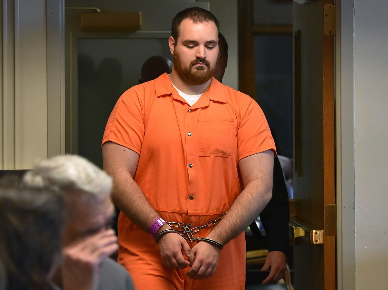 Daniel Irwin is led into the courtroom at the Oneida County Courthouse during an indictment hearing in Utica, N.Y. on Wednesday. Several members including Irwin of an insular upstate New York church have pleaded not guilty to being part of a group that beat a young man to death and injured his younger brother.