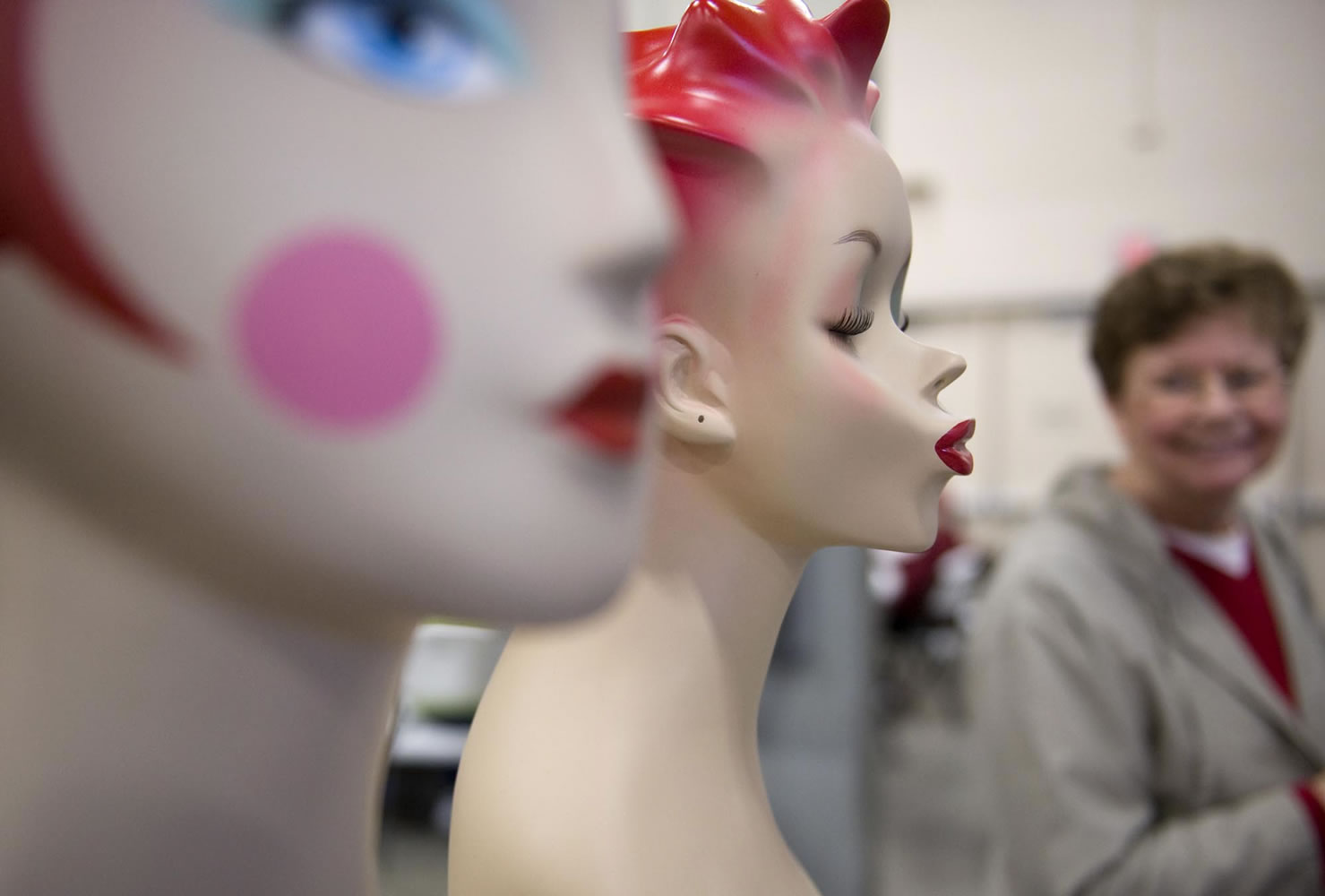 Sherry Ungrodt, right, glances at antique mannequin heads once used to display jewelry at an antique show inside the Event Center at the Clark County Fairgrounds in 2009.