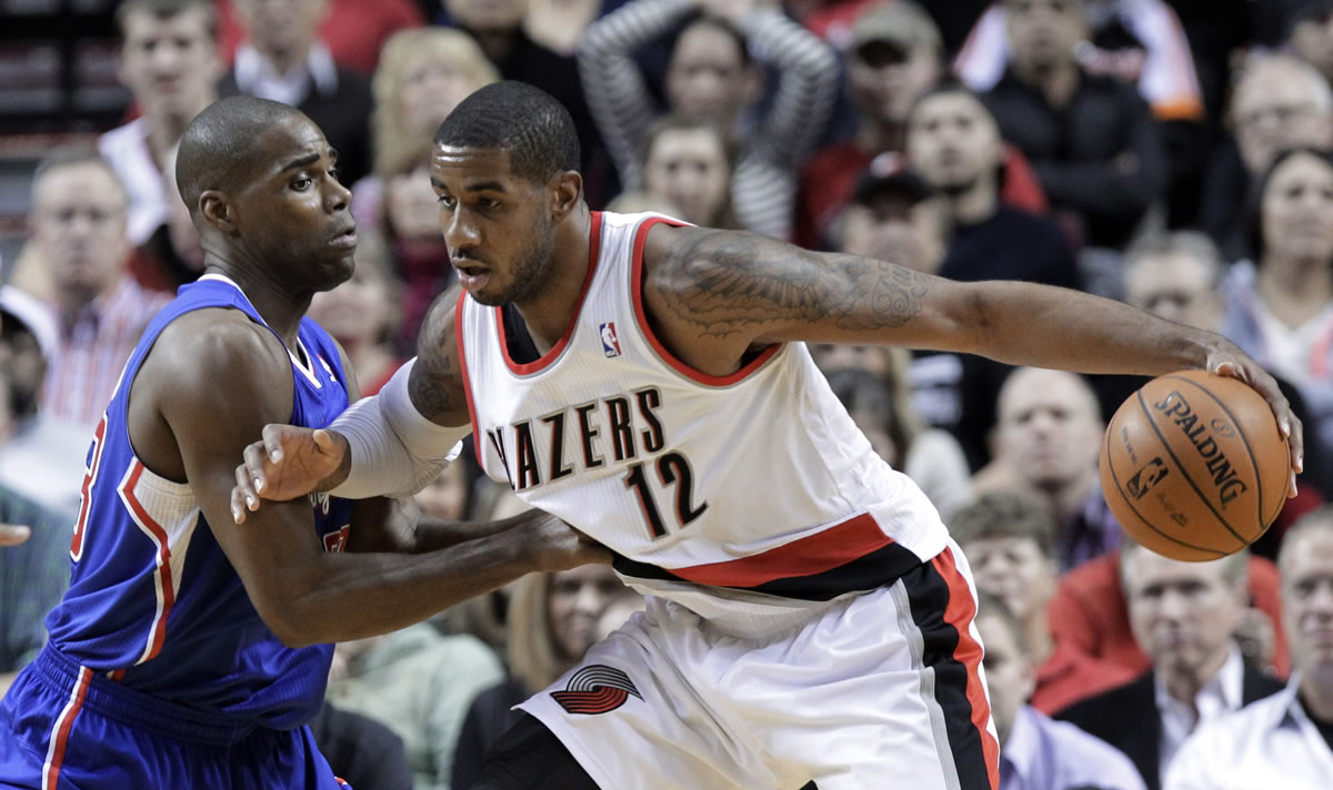 Portland Trail Blazers forward LaMarcus Aldridge, right, works the ball in on Los Angeles Clippers forward Antawn Jamison during the first half Thursday.