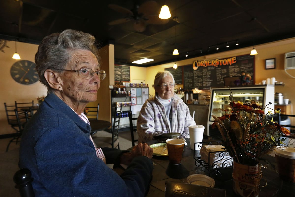 Pearl Gasser, age 80, sits with her friend Velma Drumtalk, at the Cornerstone Cafe, in the rural town of Akron, the county seat of Washington County, Colo.