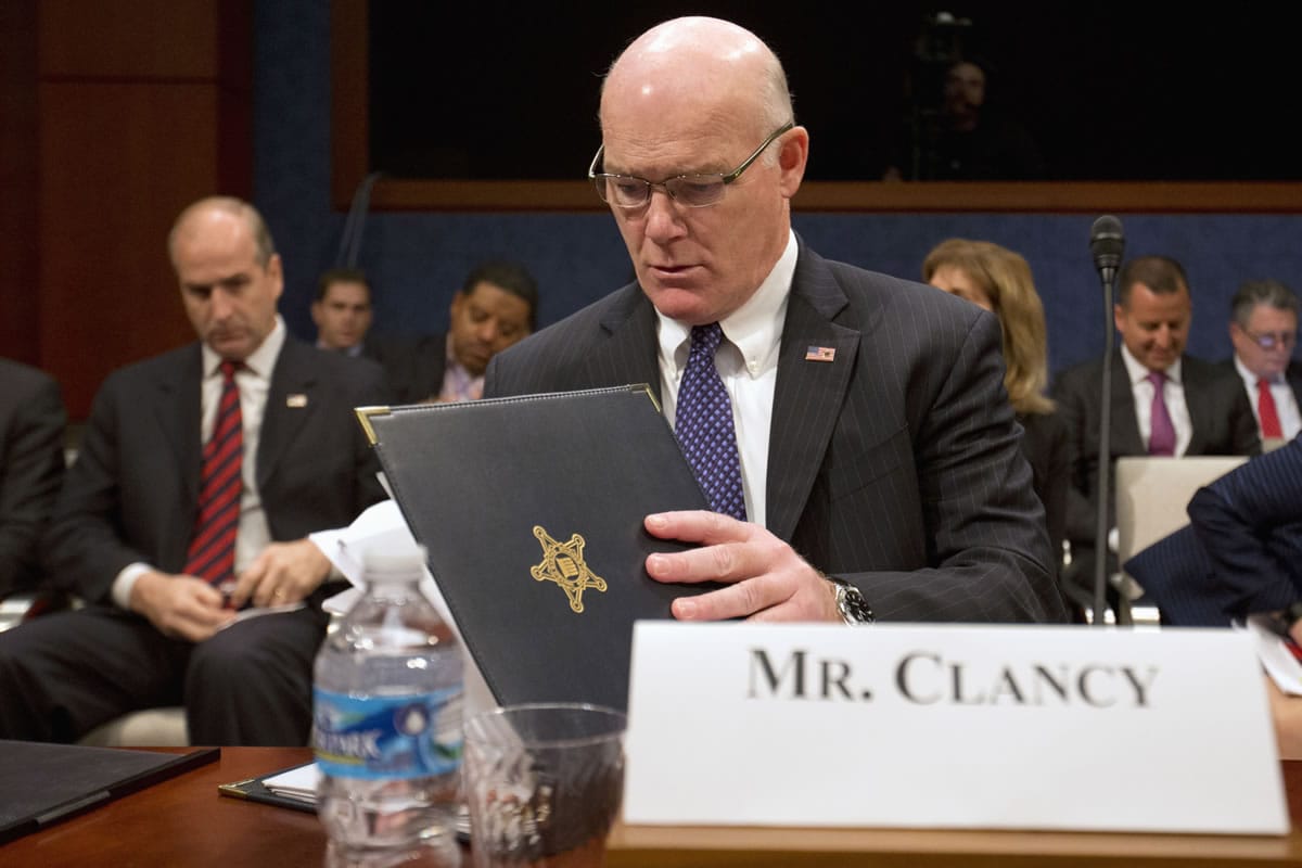 Secret Service Director Joseph Clancy looks over documents on Capitol Hill in Washington on Tuesday prior to testifying before the Senate-House Homeland Security joint subcommittees hearing on the Secret Service.