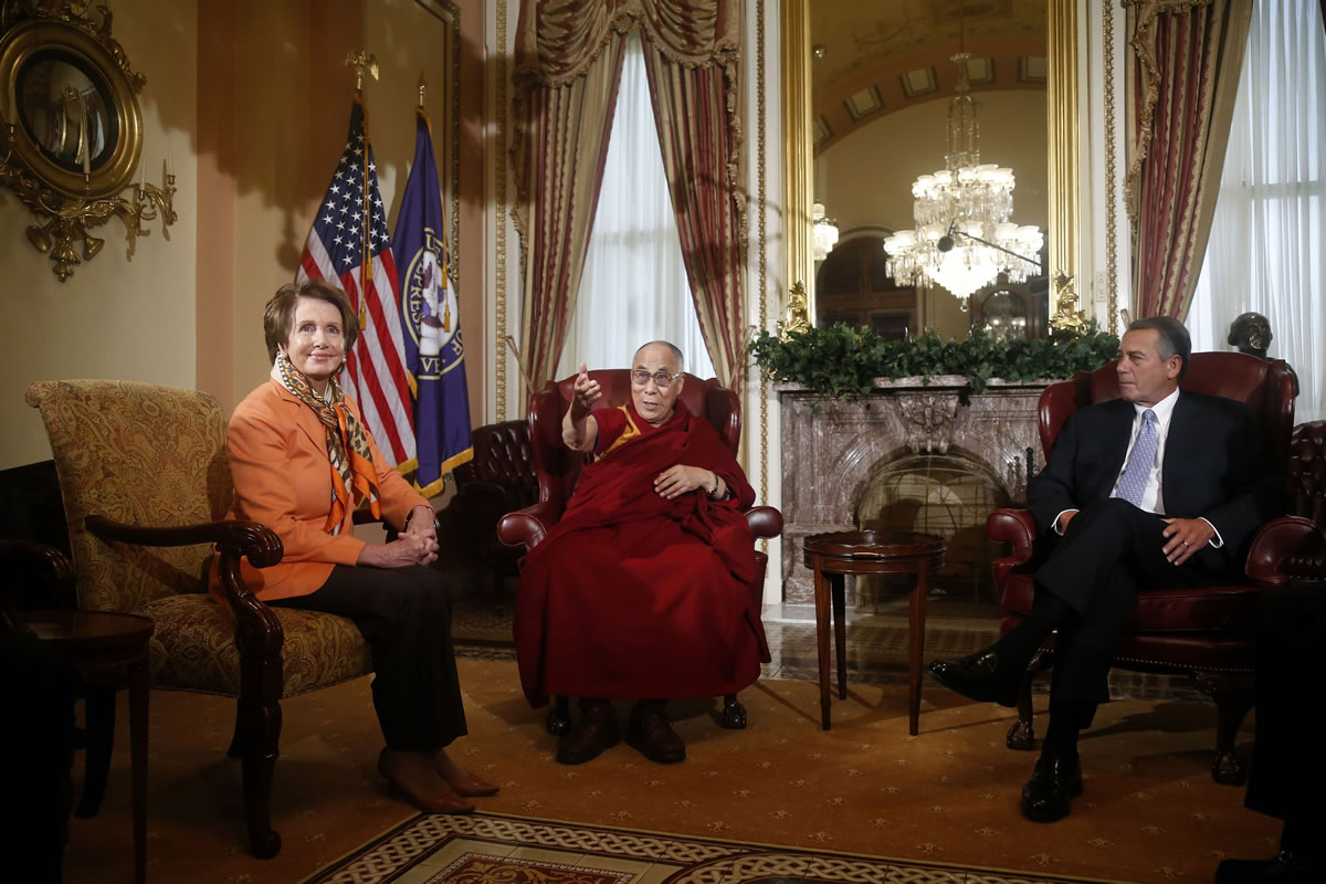 Tibetan spiritual leader the Dalai Lama meets with House Speaker John Boehner of Ohio and House Minority Leader Nancy Pelosi of Calif., on Capitol Hill in Washington on  Thursday.