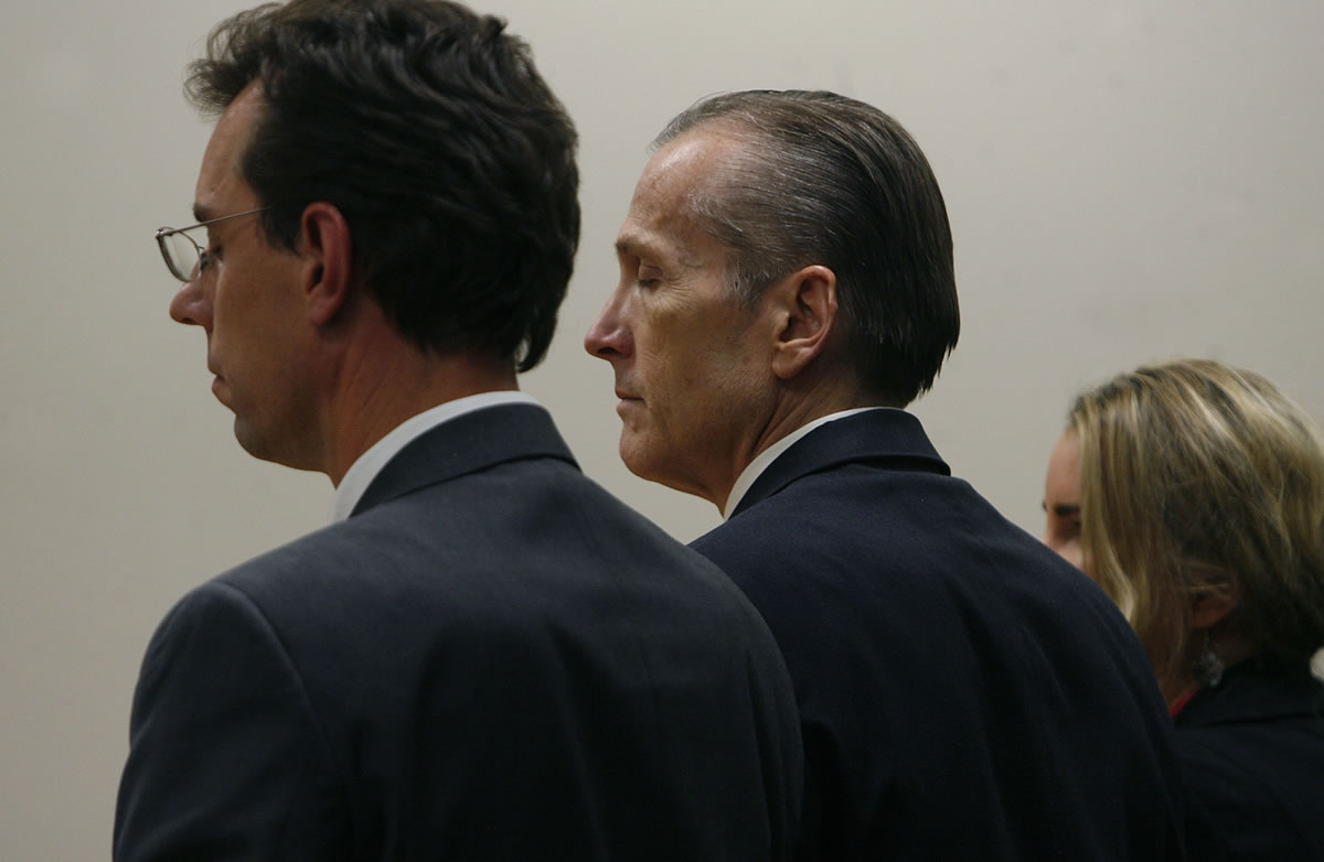 Martin MacNeill, center, reacts as the guilty verdict is read on the count of murder early Saturday.
