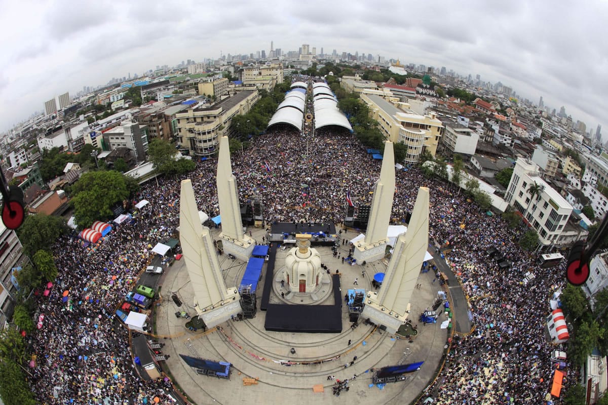 Anti-government protesters stage a rally Nov. 24, calling for Thai Prime Minister Yingluck Shinawatra to step down, at Democracy Monument in Bangkok, Thailand in this picture taken by a drone.