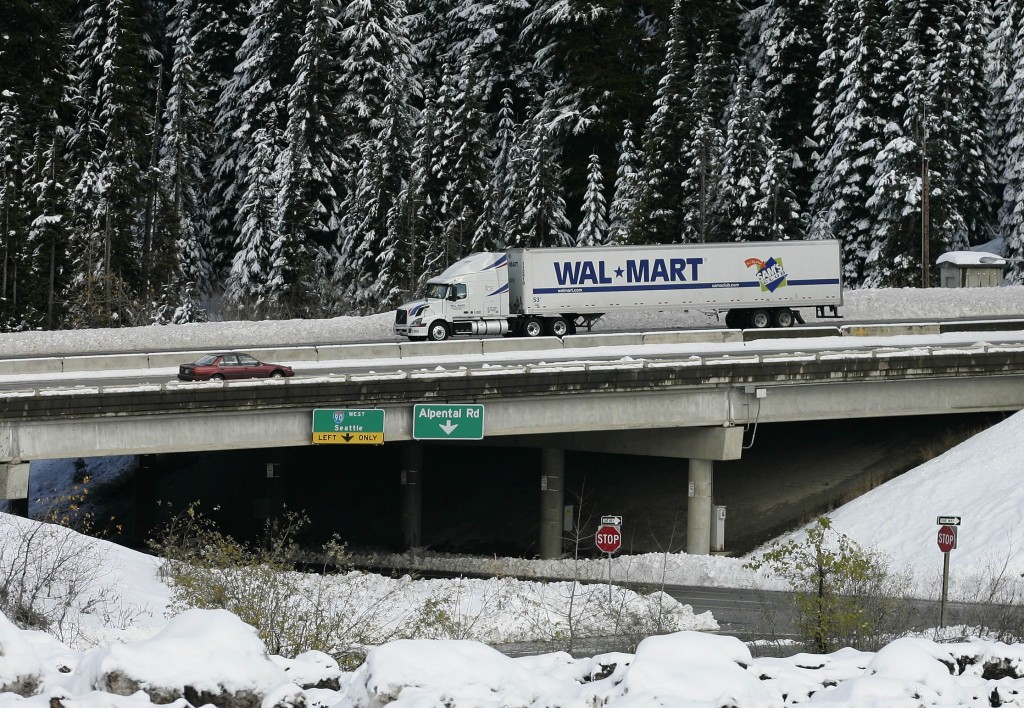 A Wal-Mart truck drives westbound through the snow on I-90 over Snoqualmie Pass near Hyak.