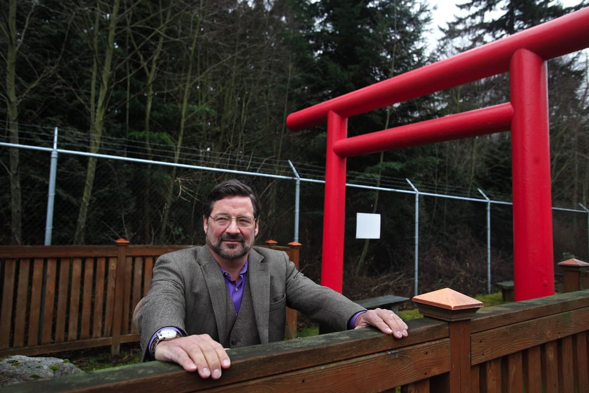 SNBL vice president for business development Mark Crane looks out from the Shinto shrine his company built at the Japanese-owned SNBL USA facility in Everett on Friday.