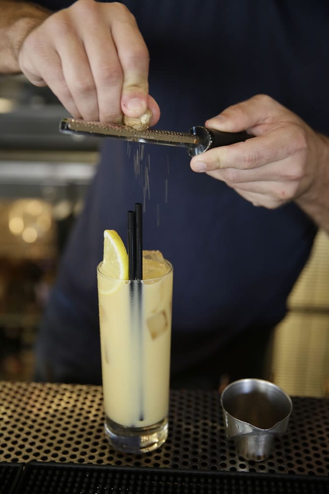 Bartender Duncan Wedderburn finishes making his Pumpkin Fizz cocktail at the Palm House restaurant in San Francisco. The recipe yields a seasonal cocktail for the holidays.