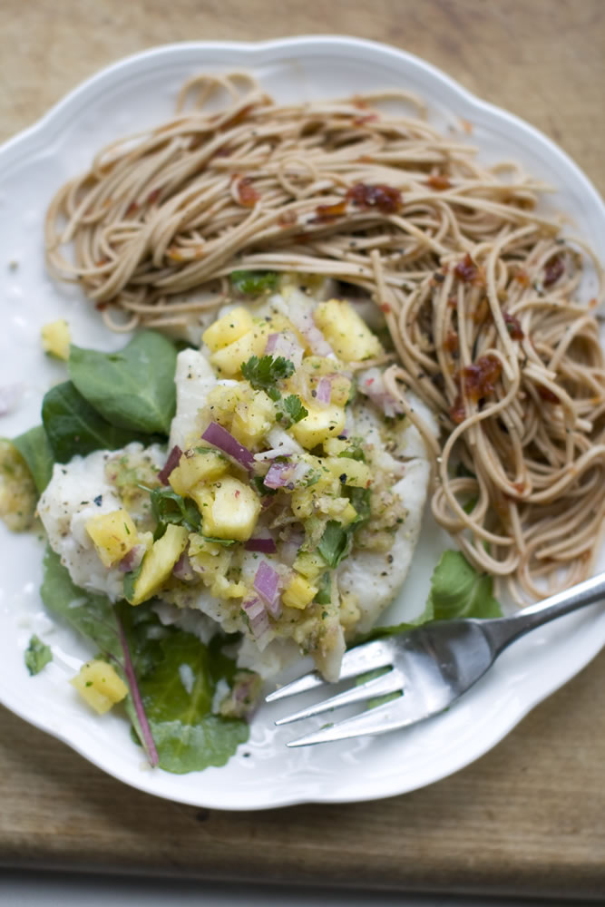 How can you prepare a good-tasting baked white fish, without adding tons of fat and calories?