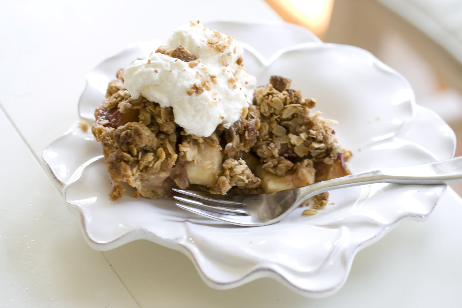 A pie made of plums, peaches and apples topped with cream, brown sugar and oat crumble streusel is baked in a purchased crust in Concord, N.H.