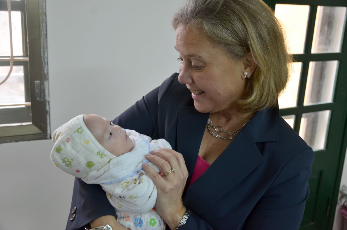 Congressional Coalition on Adoption Institute
U.S. Sen. Mary Landrieu, D-La., holds an infant in February during a visit to the Phu My Village orphanage in Vietnam. &quot;Every child needs and deserves to grow up in a family,&quot; Landrieu says.
