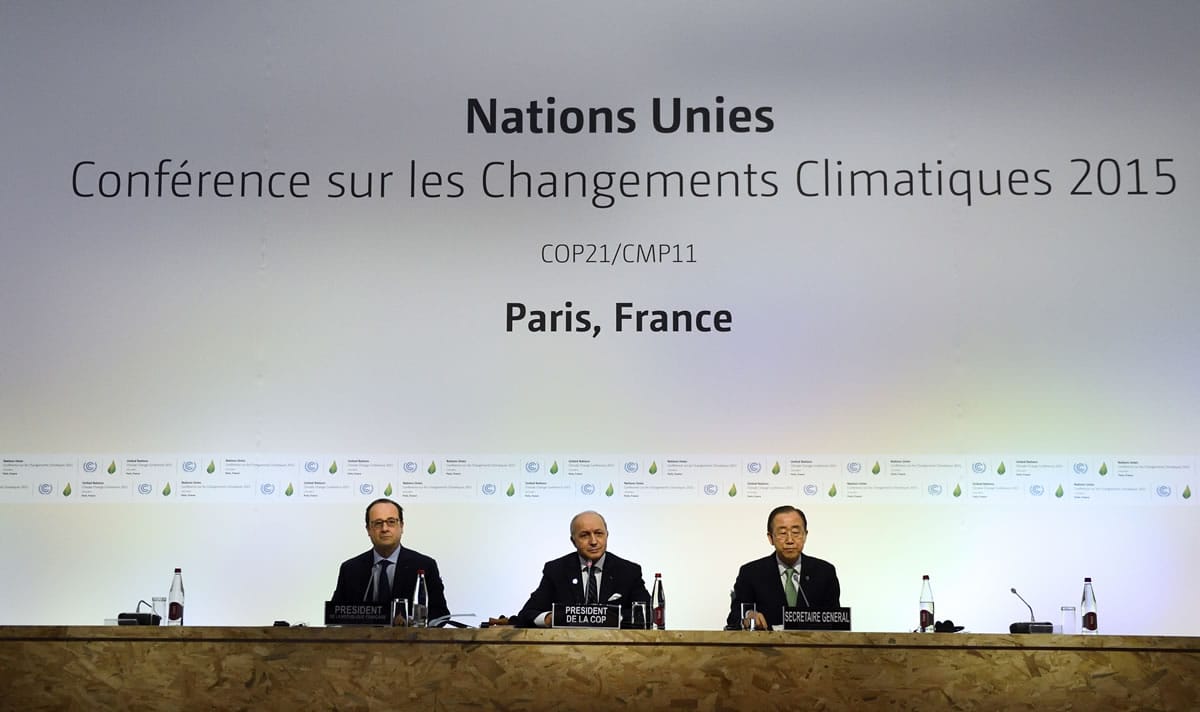 French President Francois Hollande, left, French Foreign Affairs Minister Laurent Fabius and United Nations Secretary General Ban Ki-moon, right, attend a plenary session of the COP21, United Nations Climate Change Conference, in Le Bourget, outside Paris on Monday.