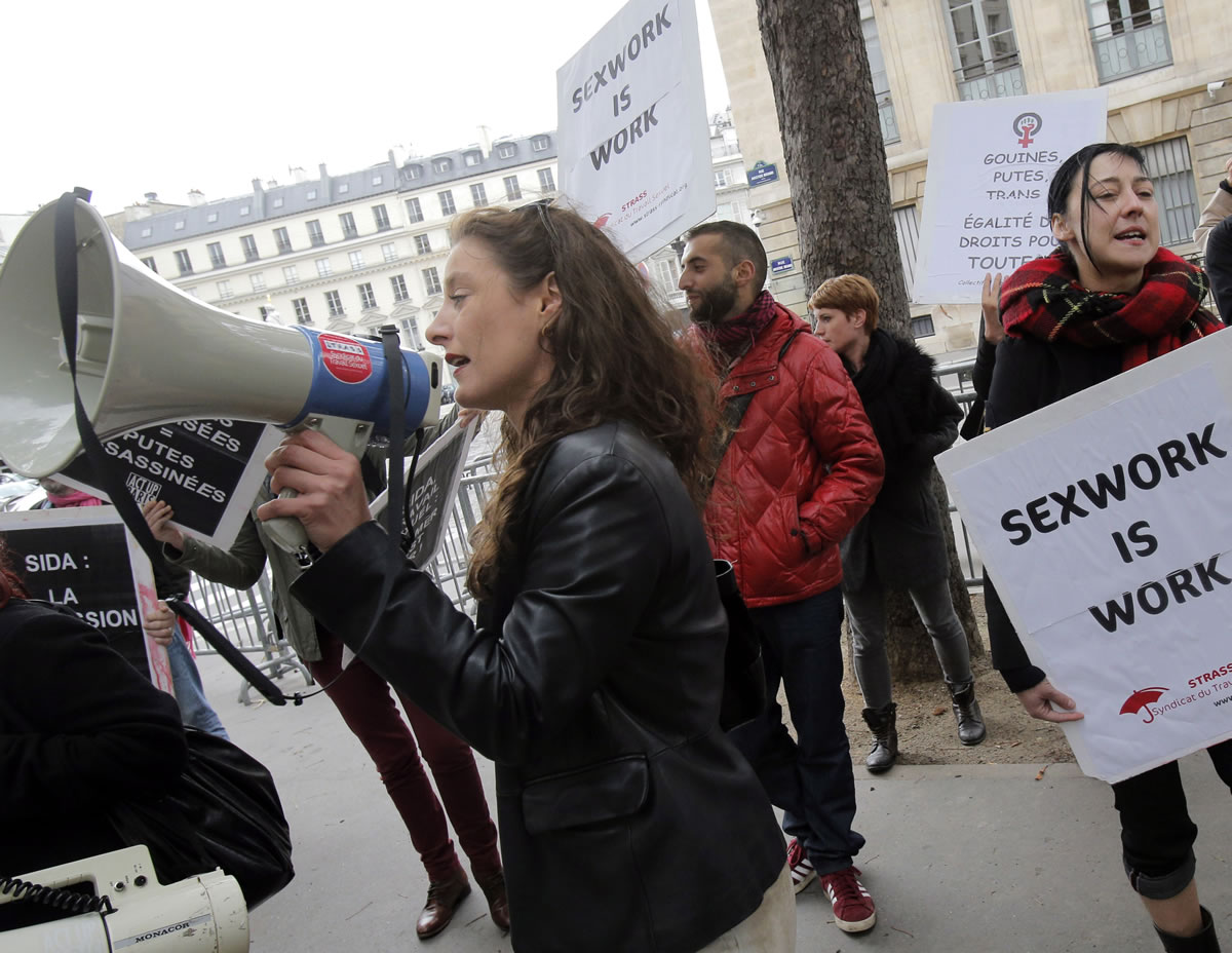 French sex workers demonstrate in front of French Assembly in Paris, against a proposal to penalise clients caught in the act of soliciting a prostitute Sept.