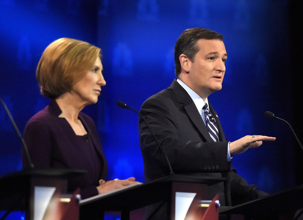 Republican presidential candidates Sen. Ted Cruz, R-Texas, and Carly Fiorina speak during Republican presidential debate at the University of Colorado on Wednesday in Boulder, Colo. (AP Photo/Mark J.