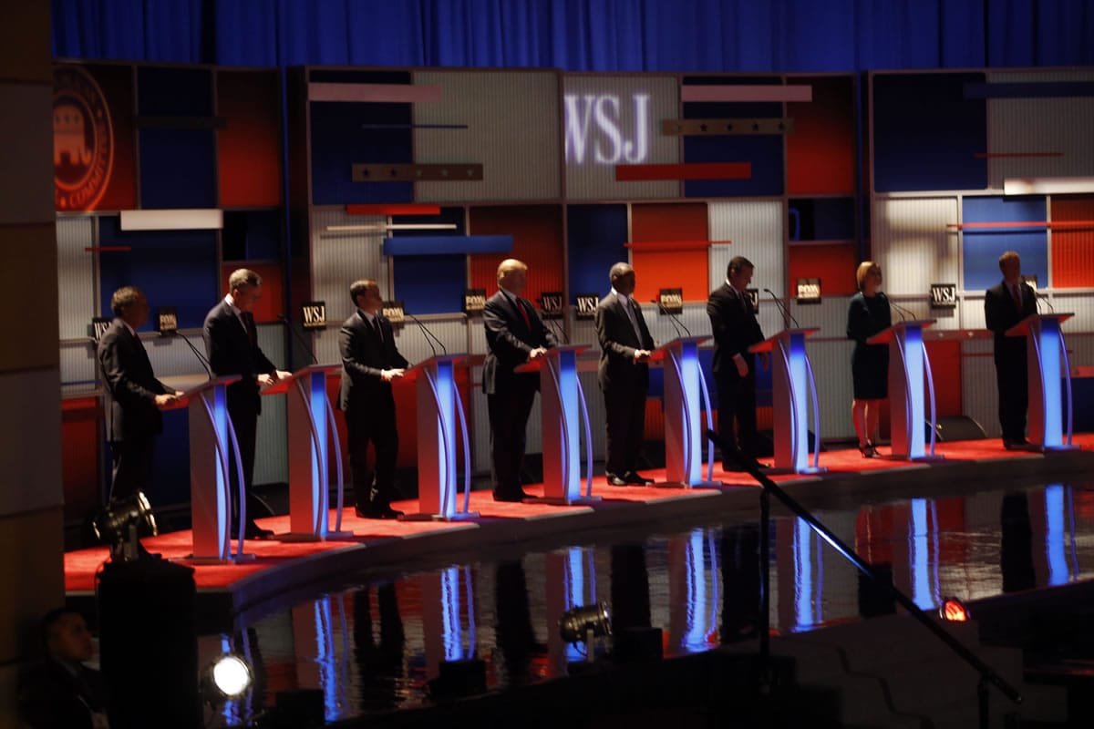 Republican presidential candidates John Kasich, Jeb Bush, Marco Rubio, Donald Trump, Ben Carson, Ted Cruz, Carly Fiorina and Rand Paul wait as they appear during Republican presidential debate at Milwaukee Theatre, Tuesday in Milwaukee.