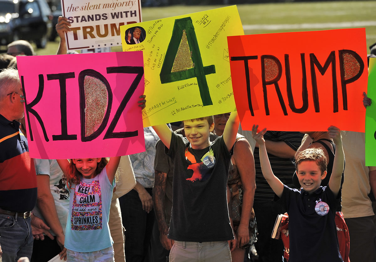 Young fans of Republican presidential candidate Donald Trump attend a campaign rally Saturday, Nov. 28, 2015 outside of Robarts Arena in Sarasota, Fla.