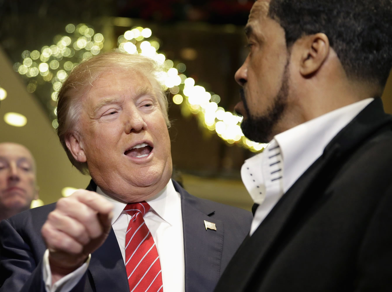 Republican presidential candidate Donald Trump, left, talks to Pastor Darrell Scott while surrounded by reporters Monday in New York. Trump met with a coalition of 100 African-American evangelical pastors and religious leaders in a private meeting at Trump Tower.
