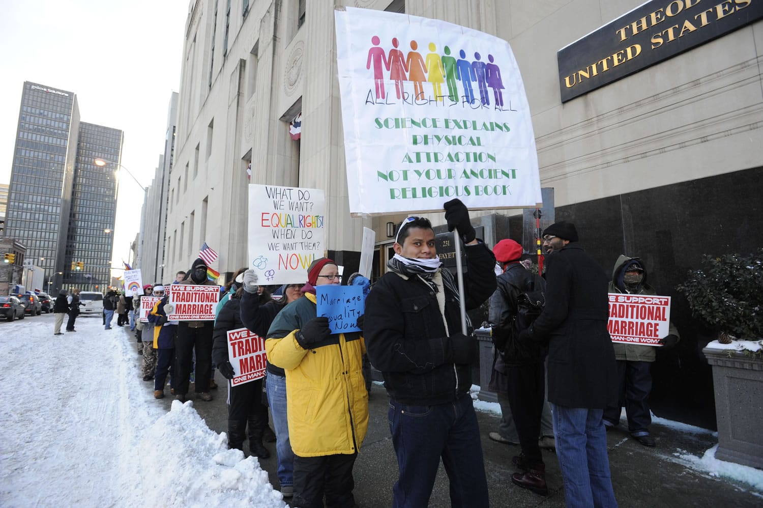 Protestors demonstrate outside Federal Courthouse before a trial that could overturn Michigan's ban on gay marriage in Detroit on Monday in Detroit.