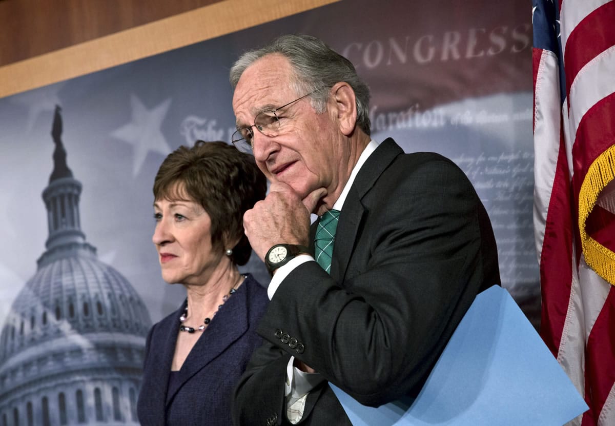 Sen. Tom Harkin, D-Iowa, right, chairman of the Health, Education, Labor, and Pensions Committee, stands with Sen.