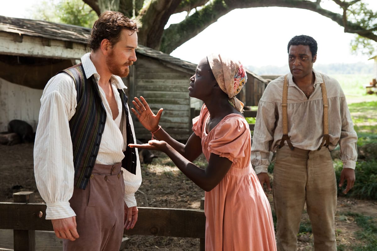 Michael Fassbender, left, Lupita Nyong'o and Chiwetel Ejiofor, right, in a scene from &quot;12 Years A Slave.&quot; Fassbender was nominated for a Golden Globe for best supporting actor in a motion picture, Nyong'o was nominated for best supporting actress in a motion picture and Ejiofor was nominated for best actor in a motion picture drama for their roles in the film.