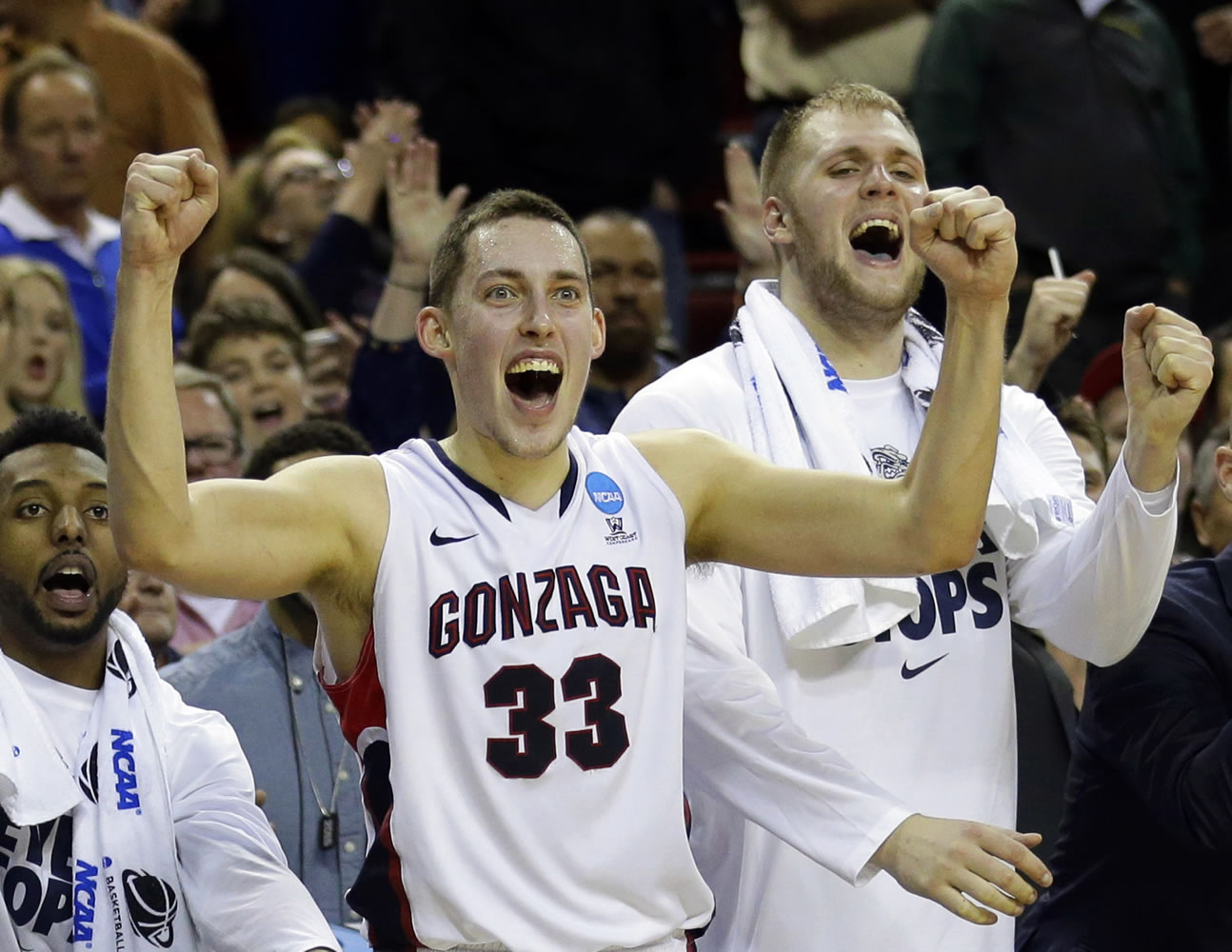 FILE - In this March 22, 2015, file photo, Gonzaga&#039;s Kyle Wiltjer (33) and Przemek Karnowski, right, celebrate in the final seconds of the second half of an NCAA tournament college basketball game against Iowa in the Round of 32, in Seattle. No. 9 Gonzaga returns a talented front court of Wiltjer, Domantas Sabonis and Karnowski to a team that reached the Elite Eight last season. But for the first time in years the situation at guard is unsettled. Four-year starting guards Kevin Pangos and Gary Bell Jr., graduated, along with senior transfer Byron Wesley.(AP Photo/Ted S.