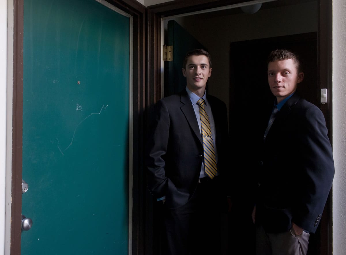 Erik Fagan, left, and Dan McIntosh stand in the doorway at their apartment in the Gonzaga University neighborhood on Nov. 8 in Spokane.
