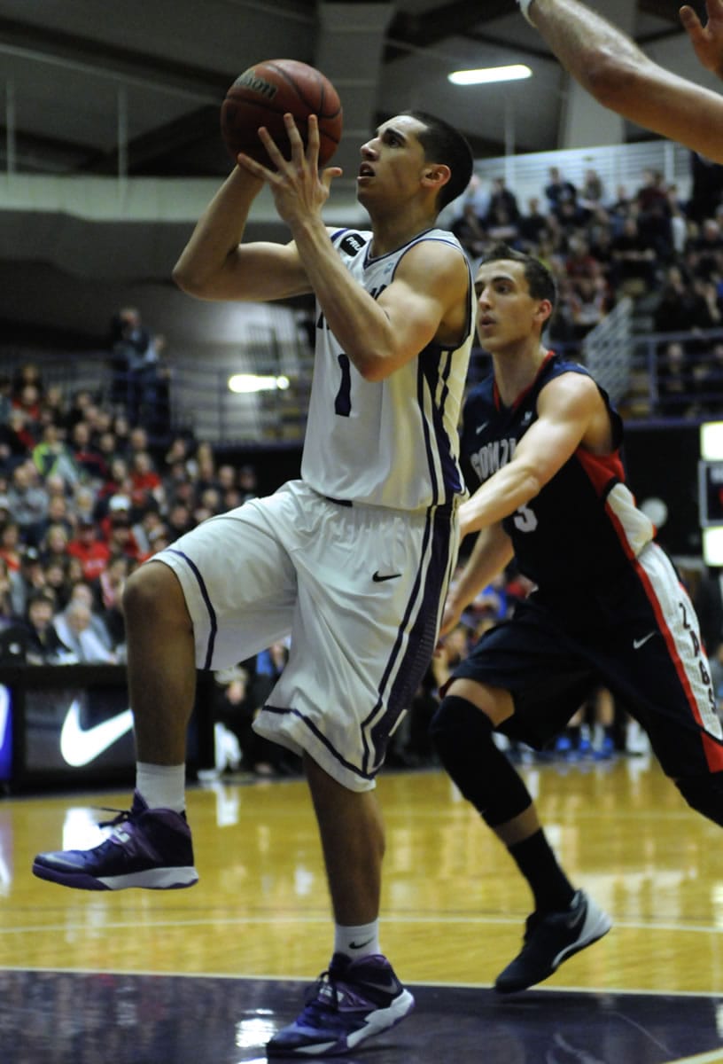 The Portland Pilots' Bryce Pressley (1) goes to the basket against the Gonzaga Bulldogs' Kyle Dranginis (3) during Thursday's West Coast Conference game at the Chiles Center.
