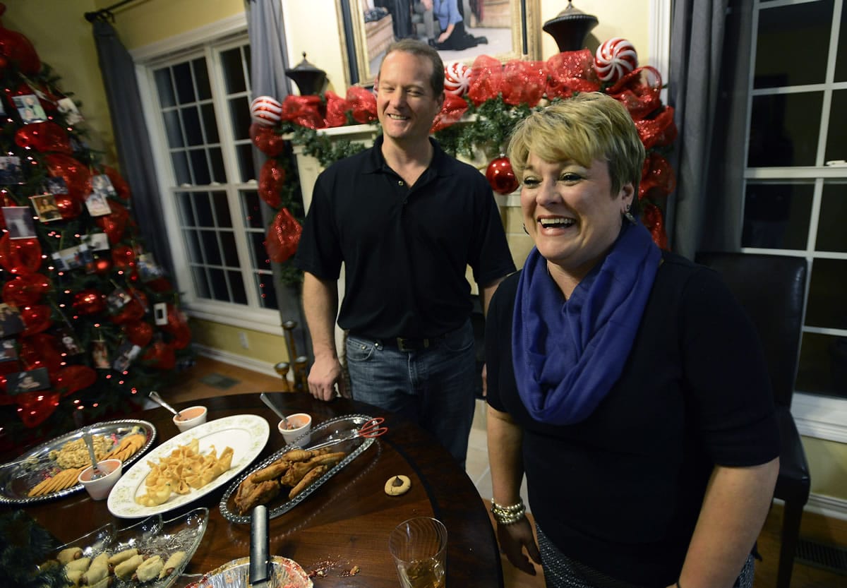 Dr. Jason Cabler and his wife, Angie, get ready for a holiday party Dec. 17 at their home in Hendersonville, Tenn.